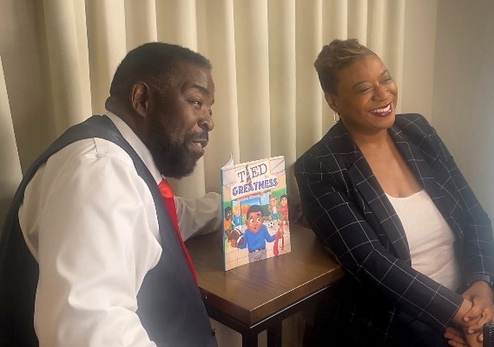 Dr. Serena Brown Travis seated with her father, Les Brown.